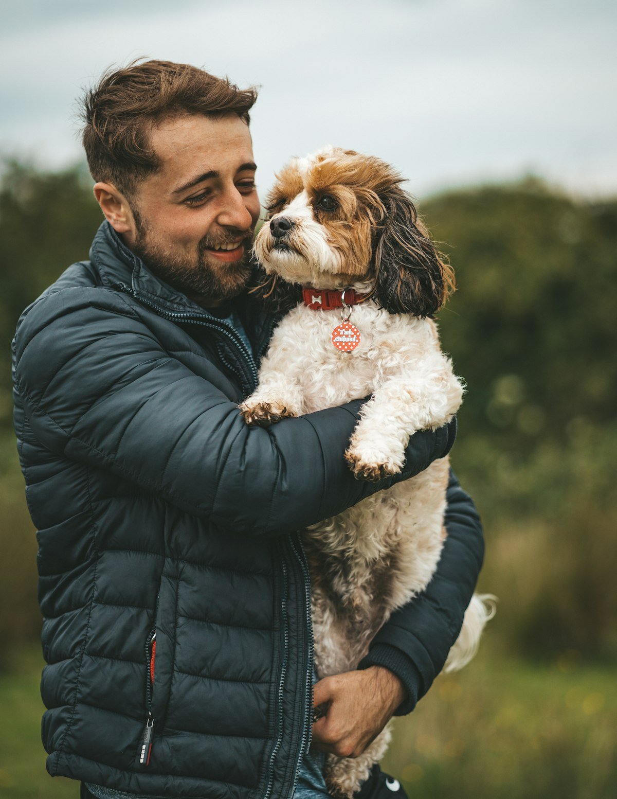 A person sharing a quiet, affectionate moment with their dog
